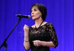 Irish singer Enya sings during a charity auction event that support children who was affected by the March 2011 earthquake and tsunami, in Tokyo, March 22, 2016. JIJI PRESS PHOTO / MORIO TAGA